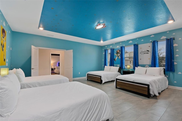4547 Narrative Ln, Kissimmee, FL 34746 - bedroom featuring a raised ceiling