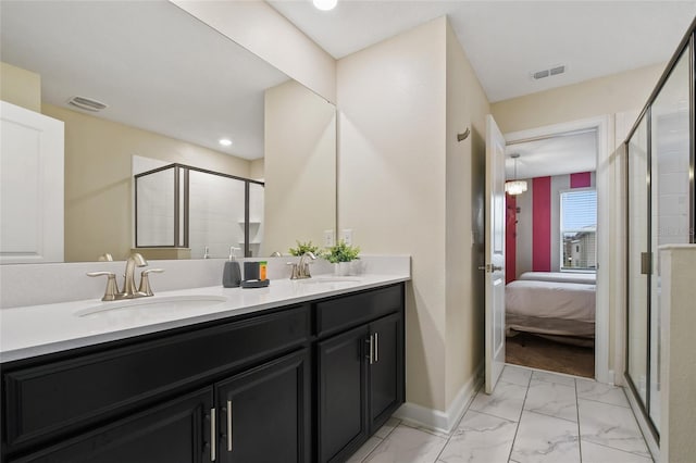 4547 Narrative Ln, Kissimmee, FL 34746 - full bathroom featuring connected bathroom, double vanity, a shower stall, and marble look tile flooring
