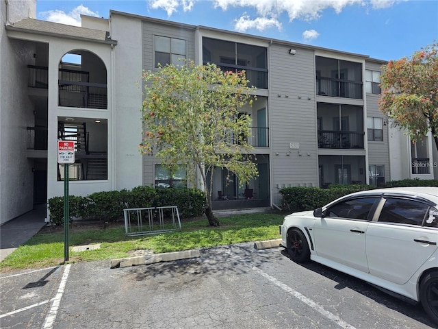 2030 Cascades Blvd Unit 204, Kissimmee, FL 34741 - view of building exterior with uncovered parking