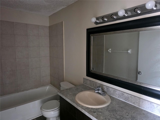 2030 Cascades Blvd Unit 204, Kissimmee, FL 34741 - bathroom featuring a textured ceiling, vanity, and shower / bathtub combination