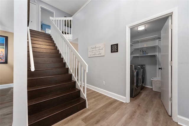 13129 Cog Hill Way, Orlando, FL 32828 - stairway with washer and dryer and wood finished floors