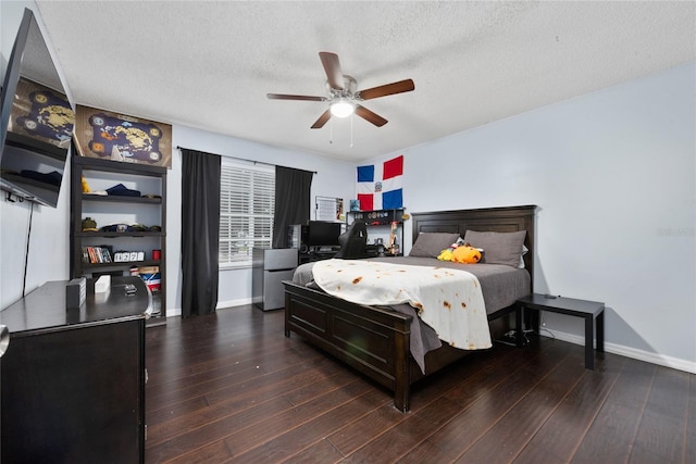 13129 Cog Hill Way, Orlando, FL 32828 - bedroom with wood finished floors, a textured ceiling, and a ceiling fan