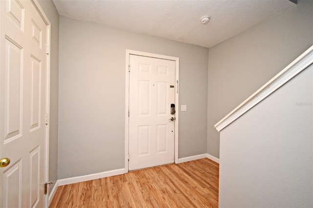 267 Goldenrain Dr Unit 30, Celebration, FL 34747 - entrance foyer with light wood-type flooring and baseboards