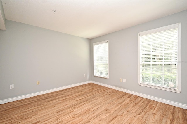 267 Goldenrain Dr Unit 30, Celebration, FL 34747 - empty room featuring light wood-style flooring