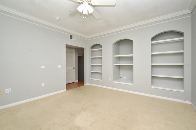 267 Goldenrain Dr Unit 30, Celebration, FL 34747 - spare room with built in features, carpet flooring, ornamental molding, and a ceiling fan