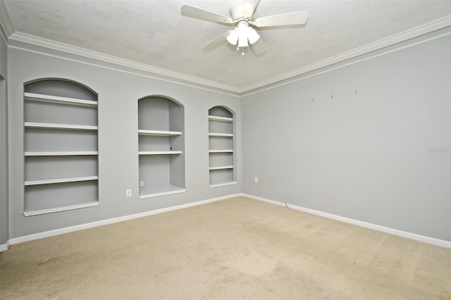 267 Goldenrain Dr Unit 30, Celebration, FL 34747 - unfurnished room featuring built in features, carpet, ornamental molding, and ceiling fan
