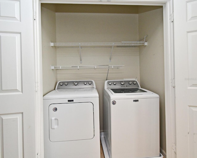267 Goldenrain Dr Unit 30, Celebration, FL 34747 - laundry area featuring washer and dryer