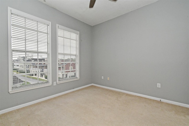 267 Goldenrain Dr Unit 30, Celebration, FL 34747 - empty room with light carpet and a ceiling fan
