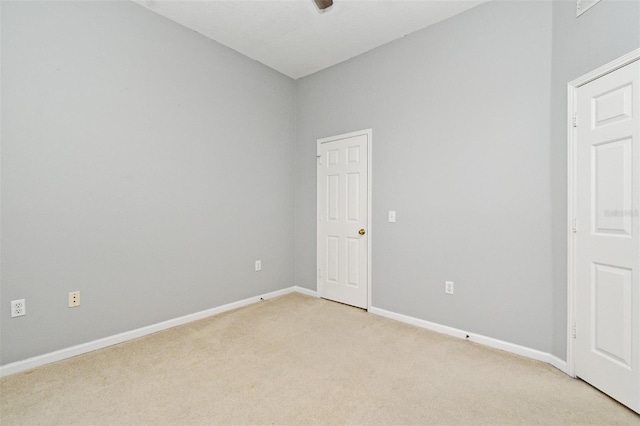 267 Goldenrain Dr Unit 30, Celebration, FL 34747 - spare room featuring light colored carpet and baseboards