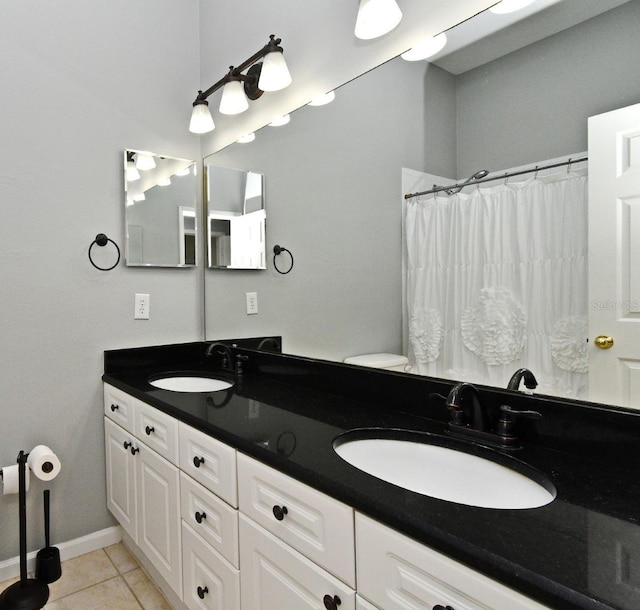 267 Goldenrain Dr Unit 30, Celebration, FL 34747 - full bath with tile patterned floors, double vanity, and a shower with shower curtain