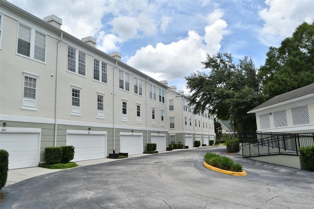267 Goldenrain Dr Unit 30, Celebration, FL 34747 - view of building exterior featuring an attached garage