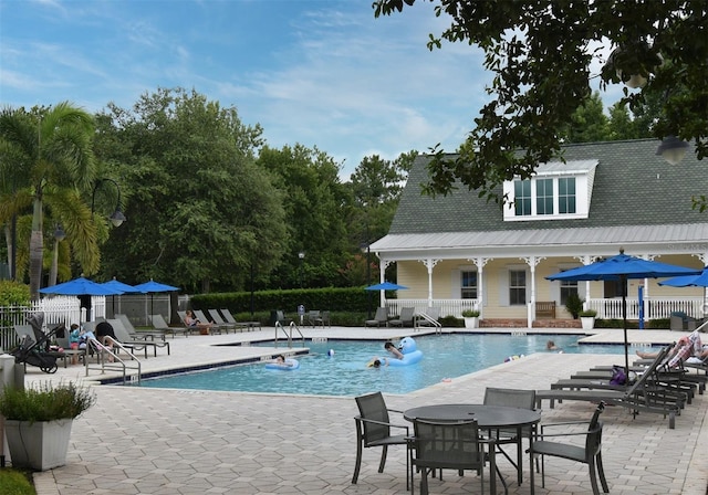 267 Goldenrain Dr Unit 30, Celebration, FL 34747 - community pool with a patio