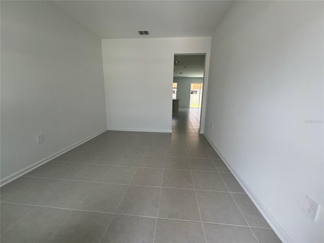 2626 Skyline Loop, Kissimmee, FL 34758 - tiled empty room with baseboards