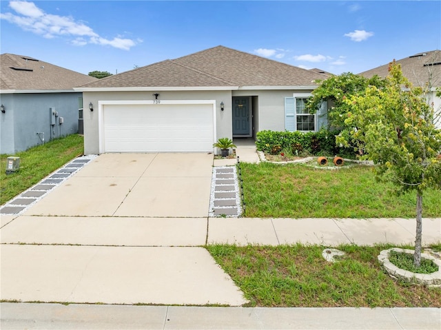 739 Jefferson, Davenport, FL 33837 - ranch-style home with stucco siding, an attached garage, driveway, roof with shingles, and a front lawn