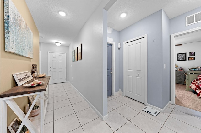739 Jefferson, Davenport, FL 33837 - hallway with a textured ceiling and light tile patterned flooring