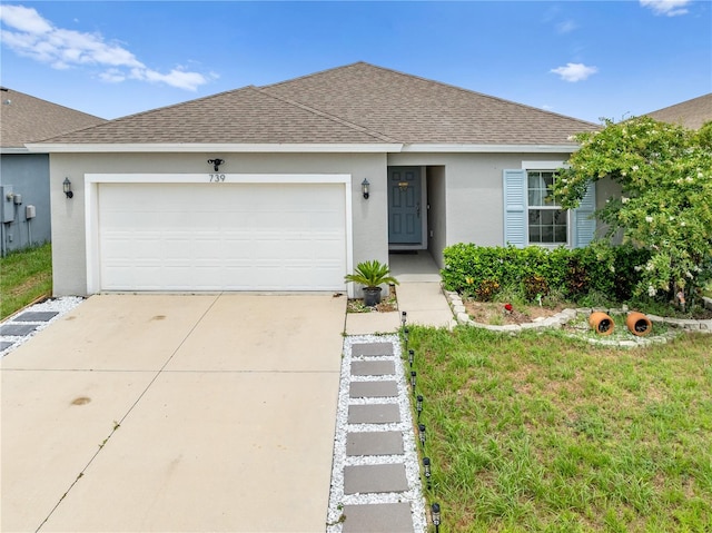 739 Jefferson, Davenport, FL 33837 - ranch-style home with roof with shingles, stucco siding, concrete driveway, and a garage