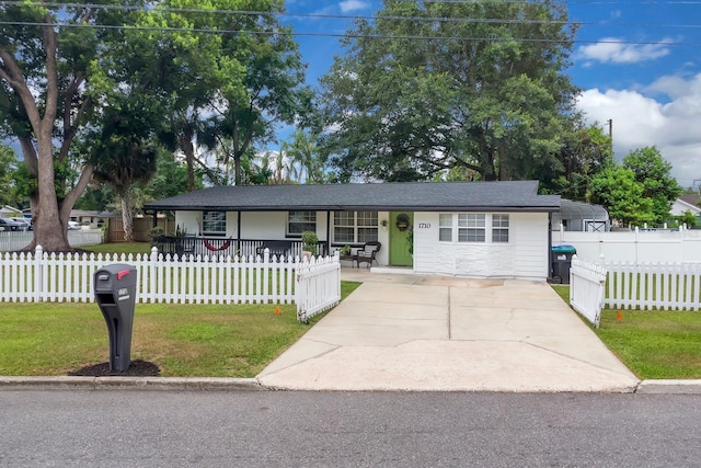 1710 Thor Ave, Apopka, FL 32703 - ranch-style house featuring covered porch, concrete driveway, and a fenced front yard