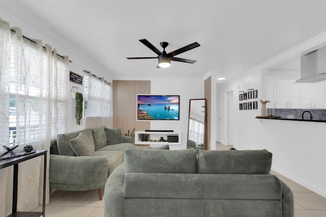 1710 Thor Ave, Apopka, FL 32703 - living area featuring light tile patterned flooring, a ceiling fan, and crown molding