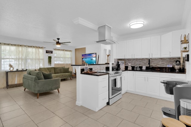 1710 Thor Ave, Apopka, FL 32703 - kitchen featuring island exhaust hood, range with electric stovetop, a peninsula, dark countertops, and backsplash
