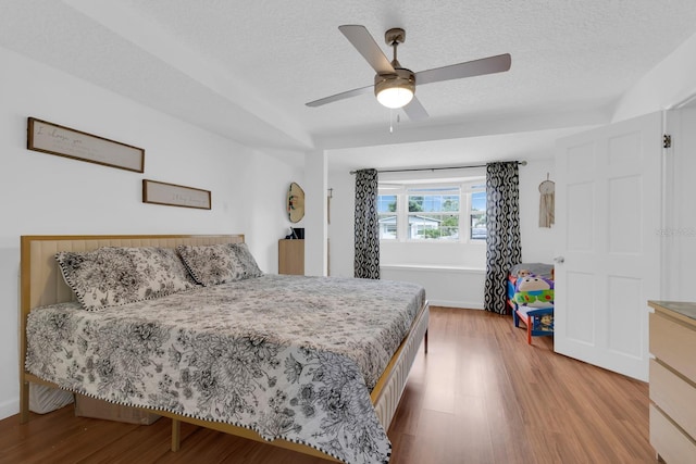 1710 Thor Ave, Apopka, FL 32703 - bedroom featuring wood finished floors, a textured ceiling, and ceiling fan