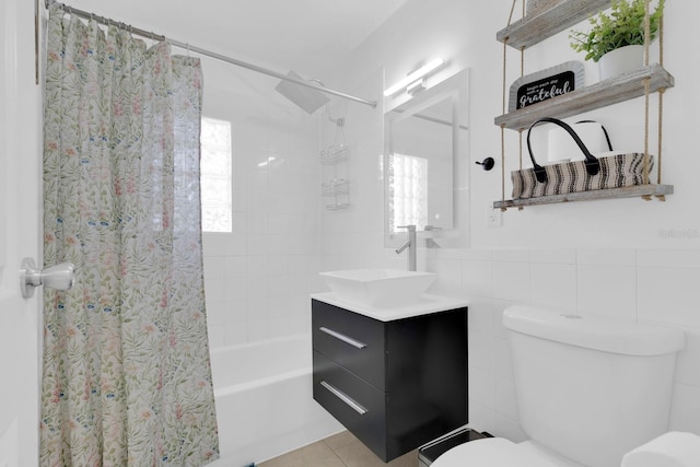 1710 Thor Ave, Apopka, FL 32703 - bathroom featuring vanity, shower / tub combo, tile patterned flooring, and tile walls