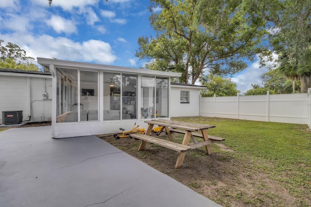 1710 Thor Ave, Apopka, FL 32703 - back of property with a sunroom, a patio, and outdoor dining area