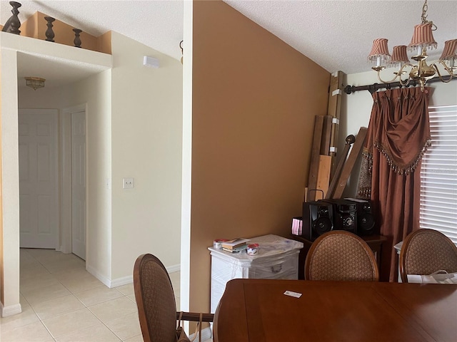 13327 Caspian Ln, Clermont, FL 34711 - dining room with a chandelier, light tile patterned floors, and a textured ceiling