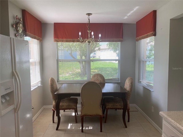 13327 Caspian Ln, Clermont, FL 34711 - dining room featuring a chandelier and light tile patterned flooring