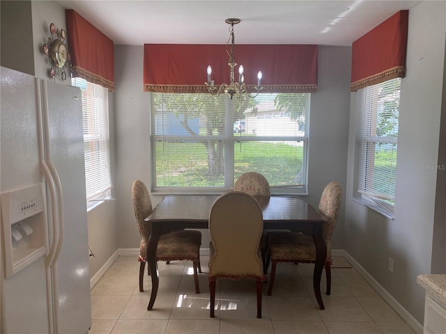 13327 Caspian Ln, Clermont, FL 34711 - dining room with a chandelier and plenty of natural light