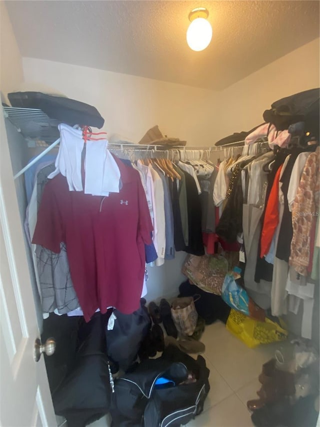 13327 Caspian Ln, Clermont, FL 34711 - spacious closet featuring tile patterned floors