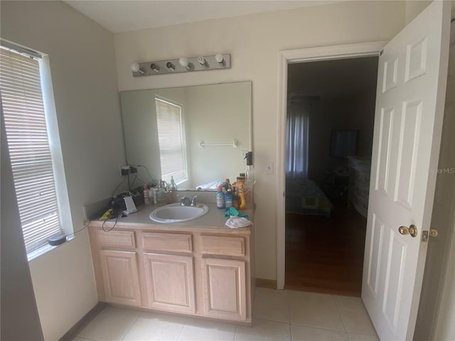 13327 Caspian Ln, Clermont, FL 34711 - bathroom with vanity, healthy amount of natural light, and tile patterned floors