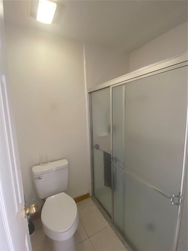 13327 Caspian Ln, Clermont, FL 34711 - bathroom featuring a stall shower and tile patterned flooring
