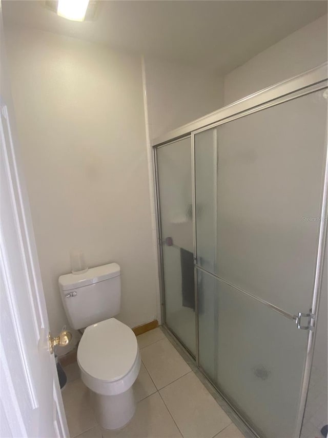 13327 Caspian Ln, Clermont, FL 34711 - bathroom with a stall shower and tile patterned floors