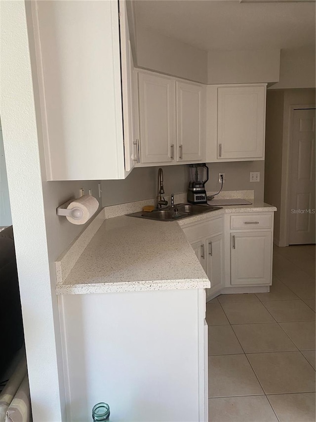 13327 Caspian Ln, Clermont, FL 34711 - kitchen with light tile patterned floors and white cabinets