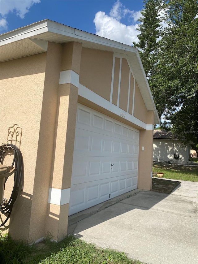 13327 Caspian Ln, Clermont, FL 34711 - garage with concrete driveway