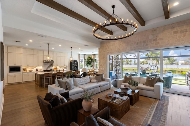 9352 Santorini Dr, Orlando, FL 32827 - living room with beam ceiling, a towering ceiling, dark wood-style floors, a chandelier, and recessed lighting