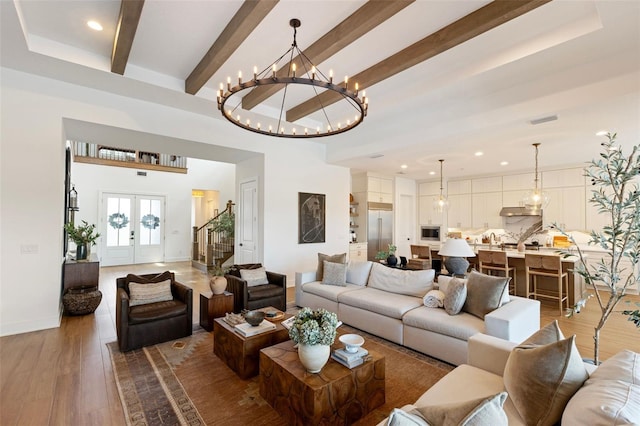 9352 Santorini Dr, Orlando, FL 32827 - living area with stairway, recessed lighting, a chandelier, beamed ceiling, and wood finished floors