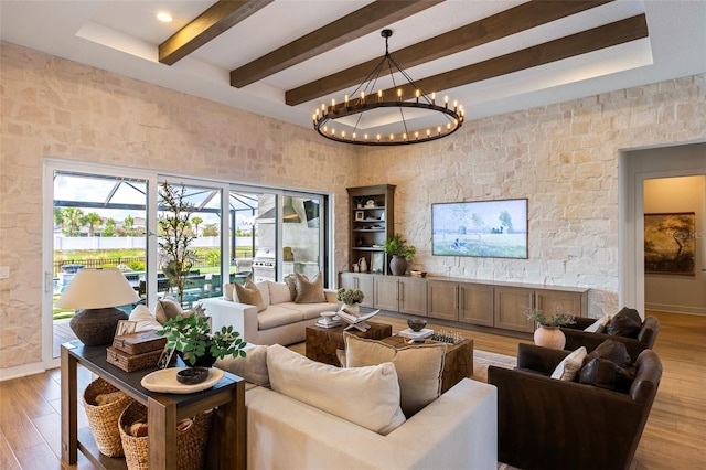 9352 Santorini Dr, Orlando, FL 32827 - living room with beam ceiling, light wood-style floors, and a chandelier