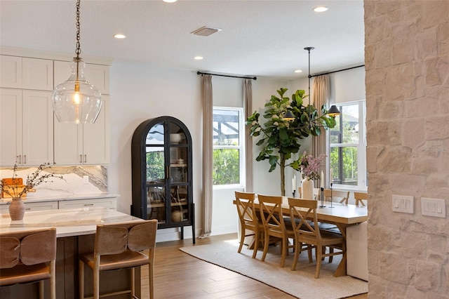 9352 Santorini Dr, Orlando, FL 32827 - dining area featuring hardwood / wood-style floors and recessed lighting