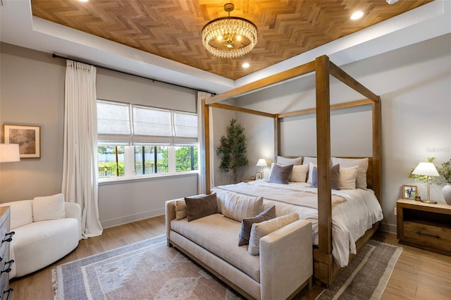 9352 Santorini Dr, Orlando, FL 32827 - bedroom featuring a chandelier, wood finished floors, recessed lighting, and an ornate ceiling