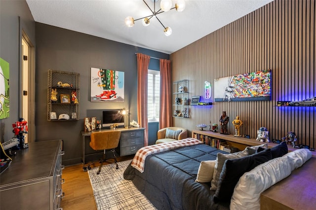 9352 Santorini Dr, Orlando, FL 32827 - bedroom featuring a chandelier, wood finished floors, and an office area