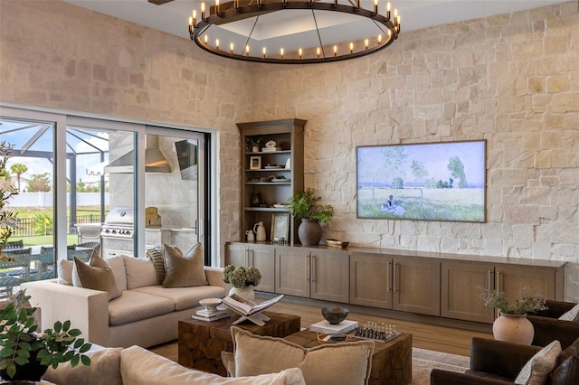 9352 Santorini Dr, Orlando, FL 32827 - living area with wood finished floors and a chandelier