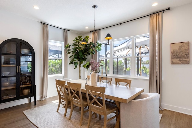 9352 Santorini Dr, Orlando, FL 32827 - dining room with wood finished floors and recessed lighting
