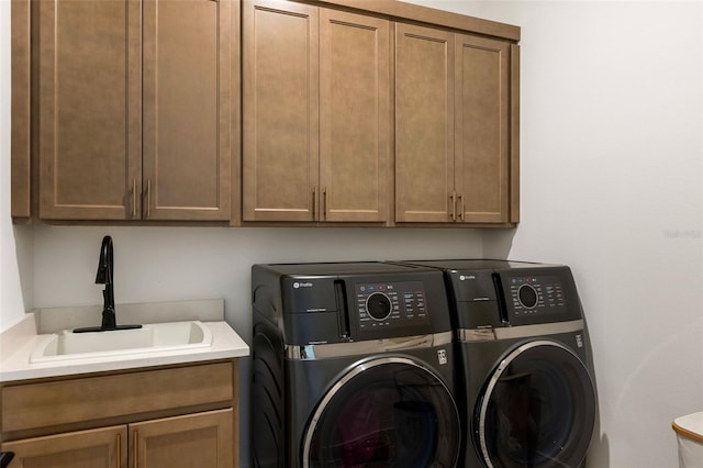 9352 Santorini Dr, Orlando, FL 32827 - washroom featuring cabinet space and washing machine and clothes dryer