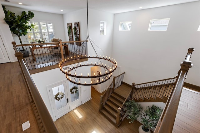 9352 Santorini Dr, Orlando, FL 32827 - staircase featuring wood finished floors and recessed lighting
