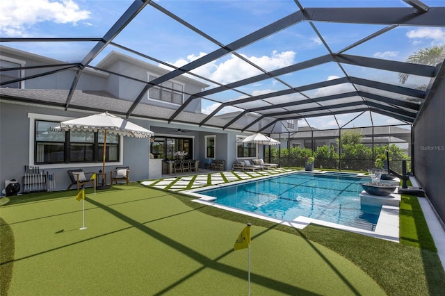 9352 Santorini Dr, Orlando, FL 32827 - swimming pool with an area to practice putting, a patio, a ceiling fan, and a lanai