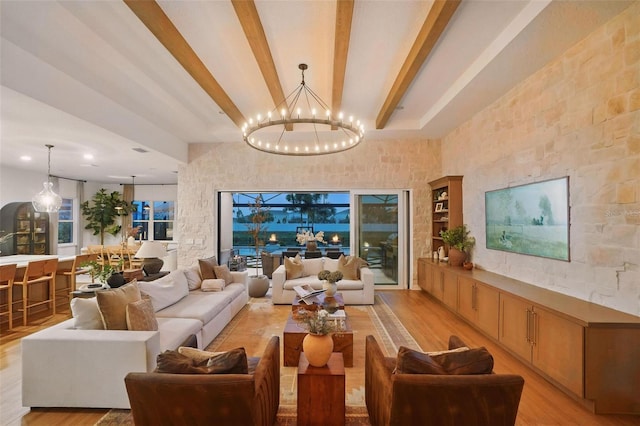 9352 Santorini Dr, Orlando, FL 32827 - living area with light wood-style flooring, beam ceiling, and a chandelier