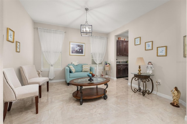 3837 Carrick Bend Dr, Kissimmee, FL 34746 - living area featuring a chandelier and light marble finish floors