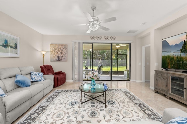 3837 Carrick Bend Dr, Kissimmee, FL 34746 - living area featuring baseboards and a ceiling fan