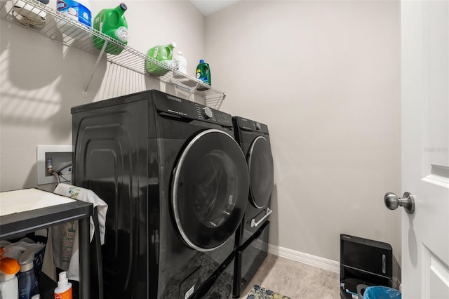 3837 Carrick Bend Dr, Kissimmee, FL 34746 - laundry room featuring separate washer and dryer and baseboards